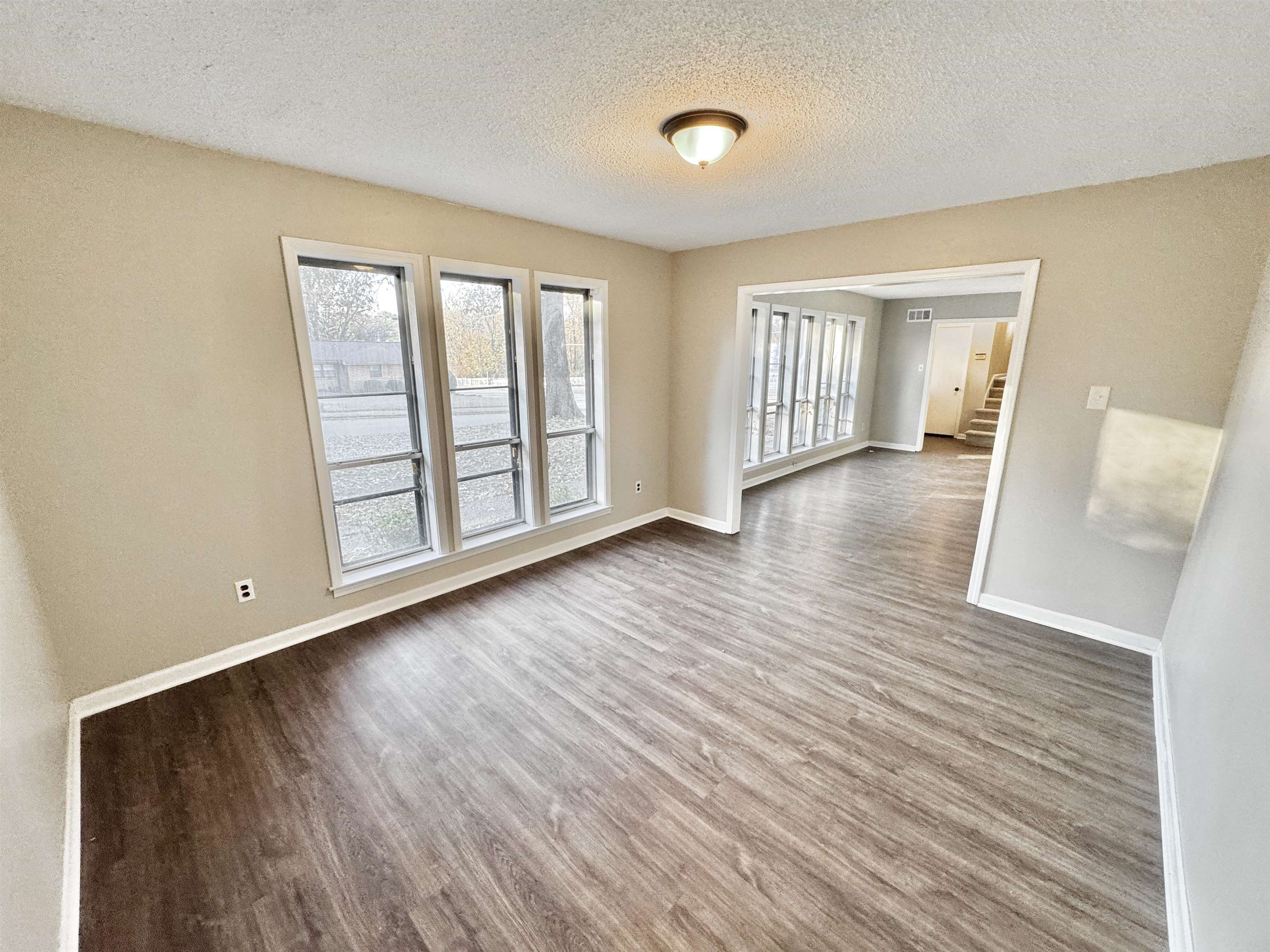3836 Birchleaf Road Memphis, TN 38116 - Photo 11 of 40 Spare room with a textured ceiling and wood finished floors