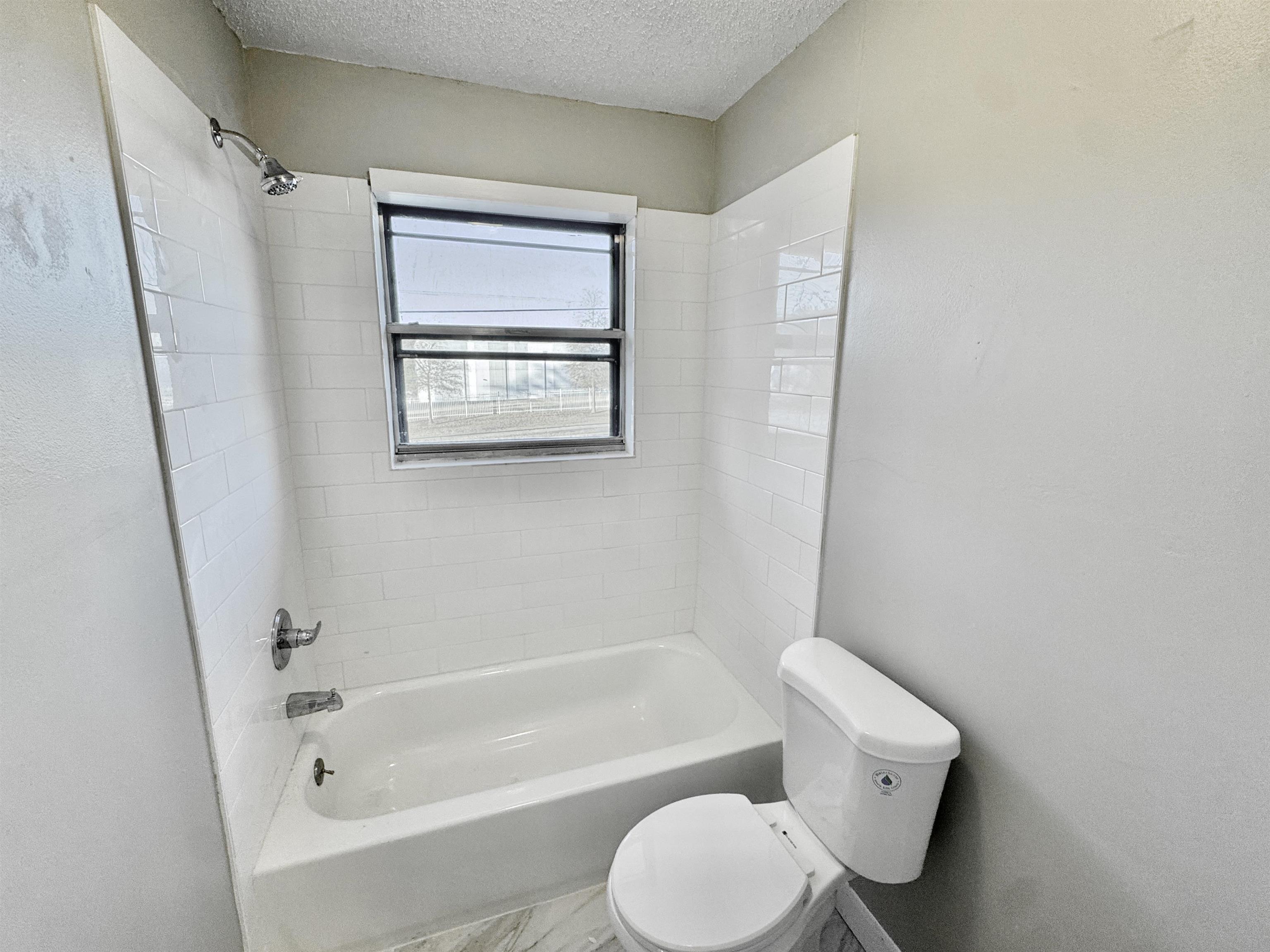 3836 Birchleaf Road Memphis, TN 38116 - Photo 14 of 40 Full bath with shower / bath combination and a textured ceiling