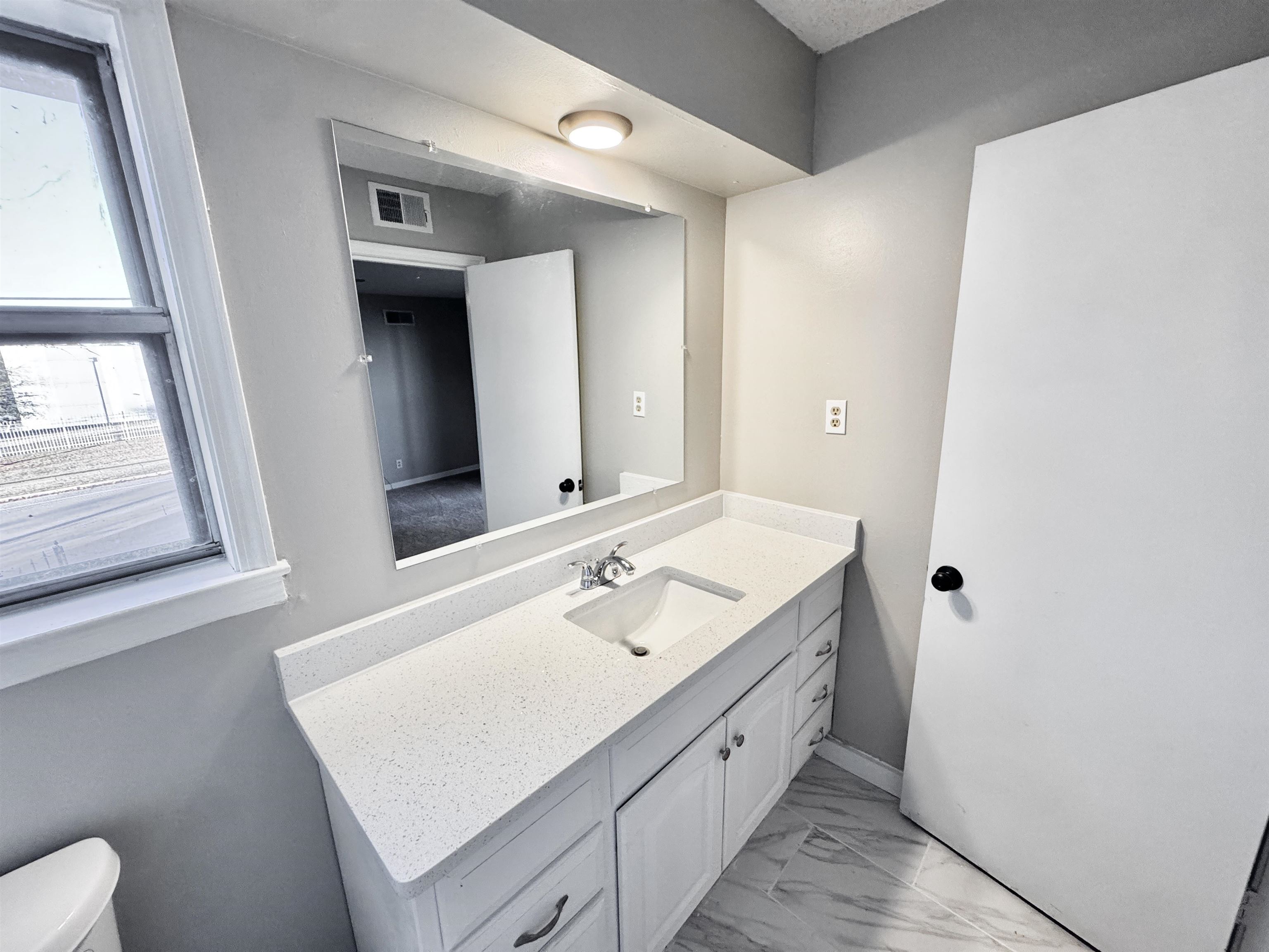3836 Birchleaf Road Memphis, TN 38116 - Photo 20 of 40 Bathroom featuring light marble finish floors and vanity