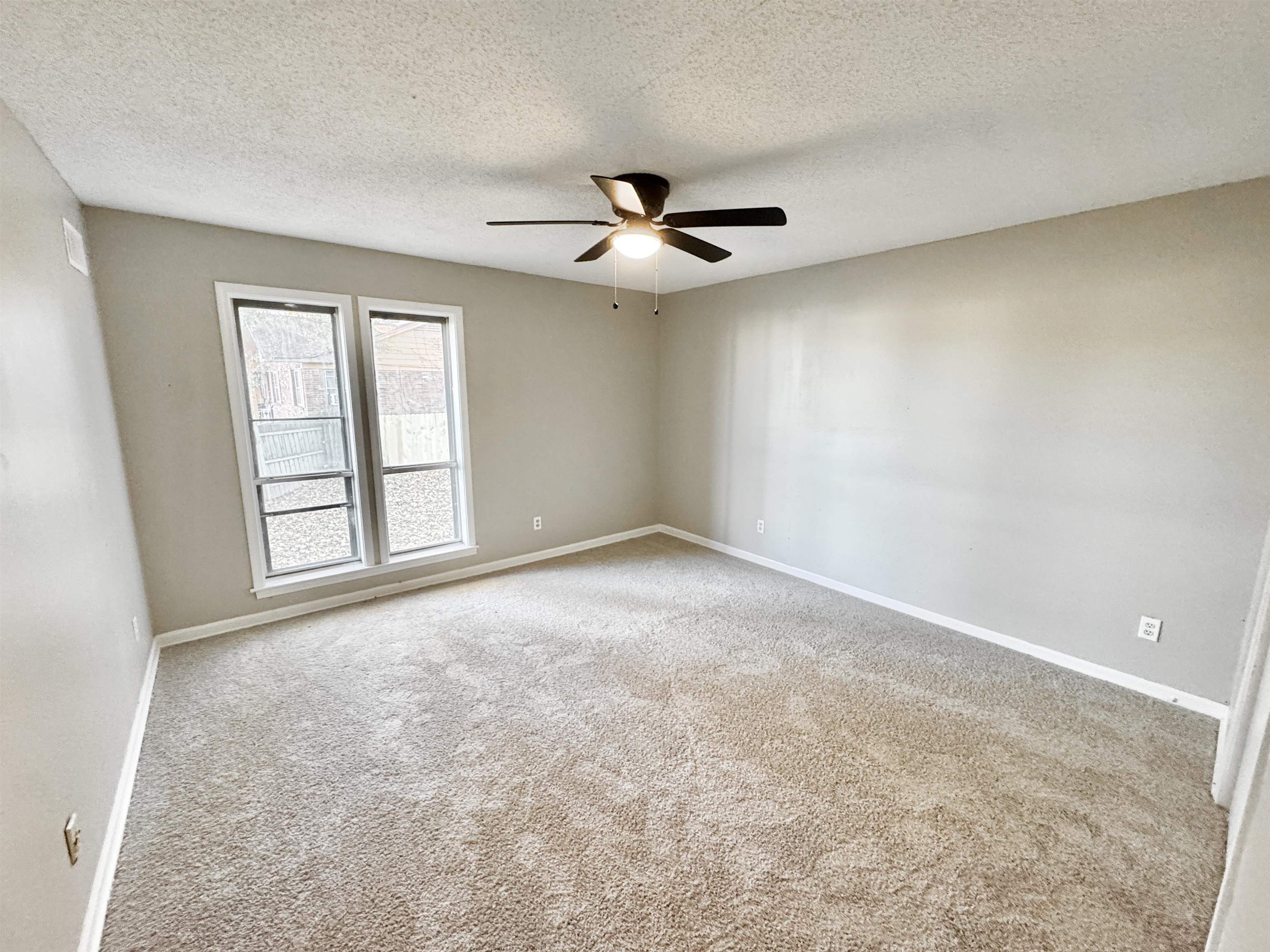 3836 Birchleaf Road Memphis, TN 38116 - Photo 23 of 40 Empty room featuring light colored carpet, a textured ceiling, and ceiling fan