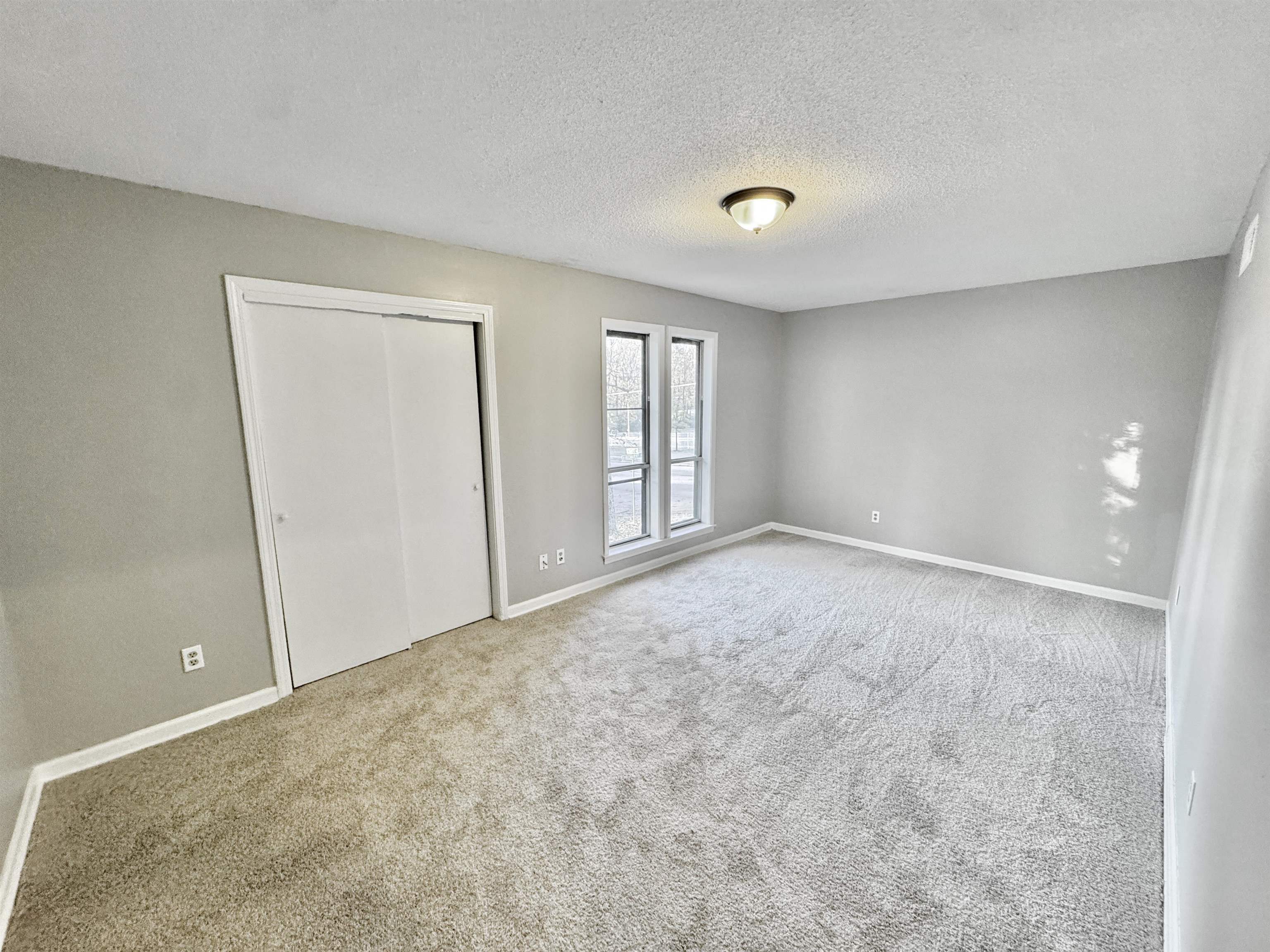 3836 Birchleaf Road Memphis, TN 38116 - Photo 25 of 40 Unfurnished bedroom featuring carpet, a textured ceiling, and a closet