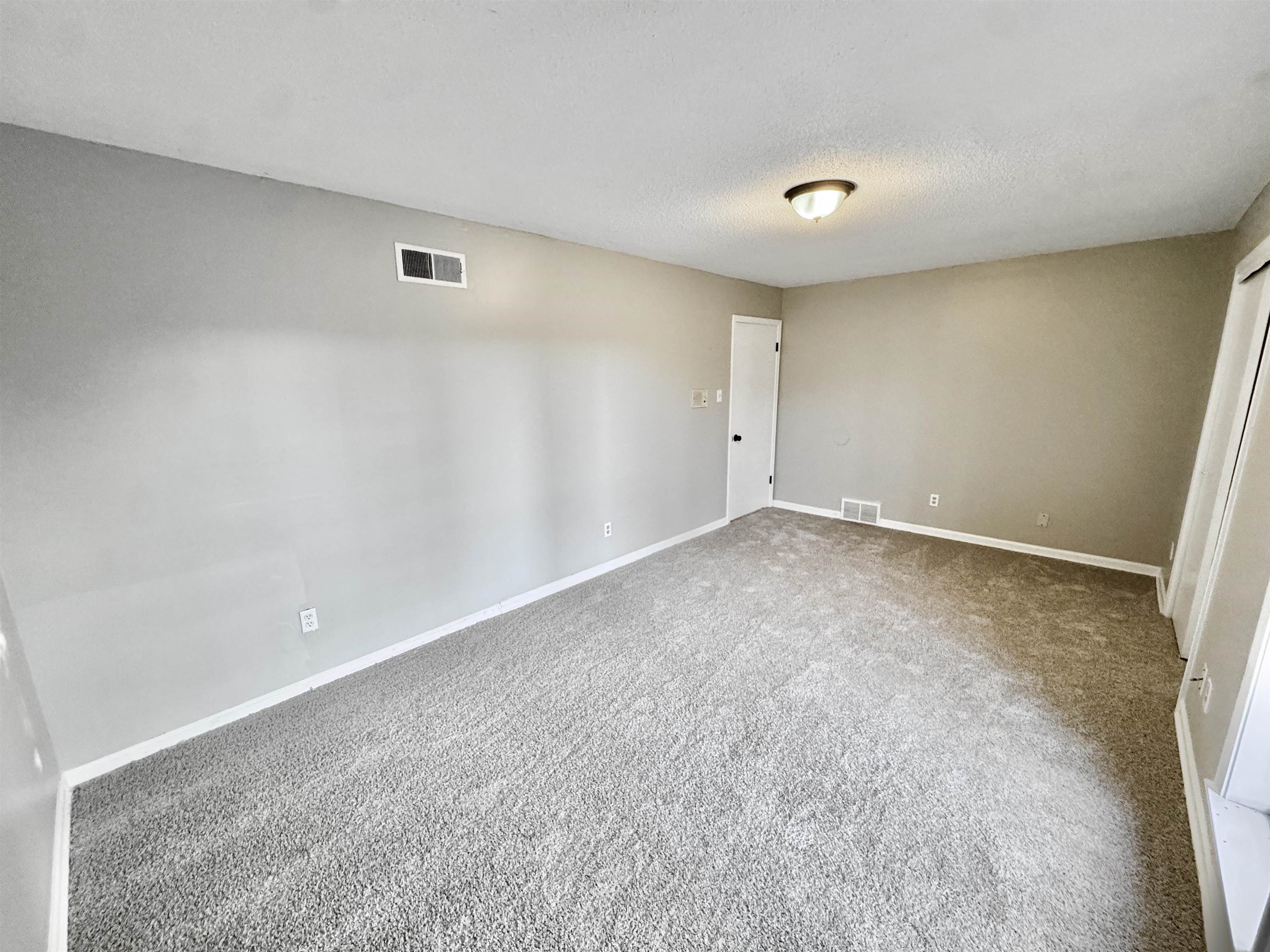 3836 Birchleaf Road Memphis, TN 38116 - Photo 26 of 40 Unfurnished room with carpet and a textured ceiling