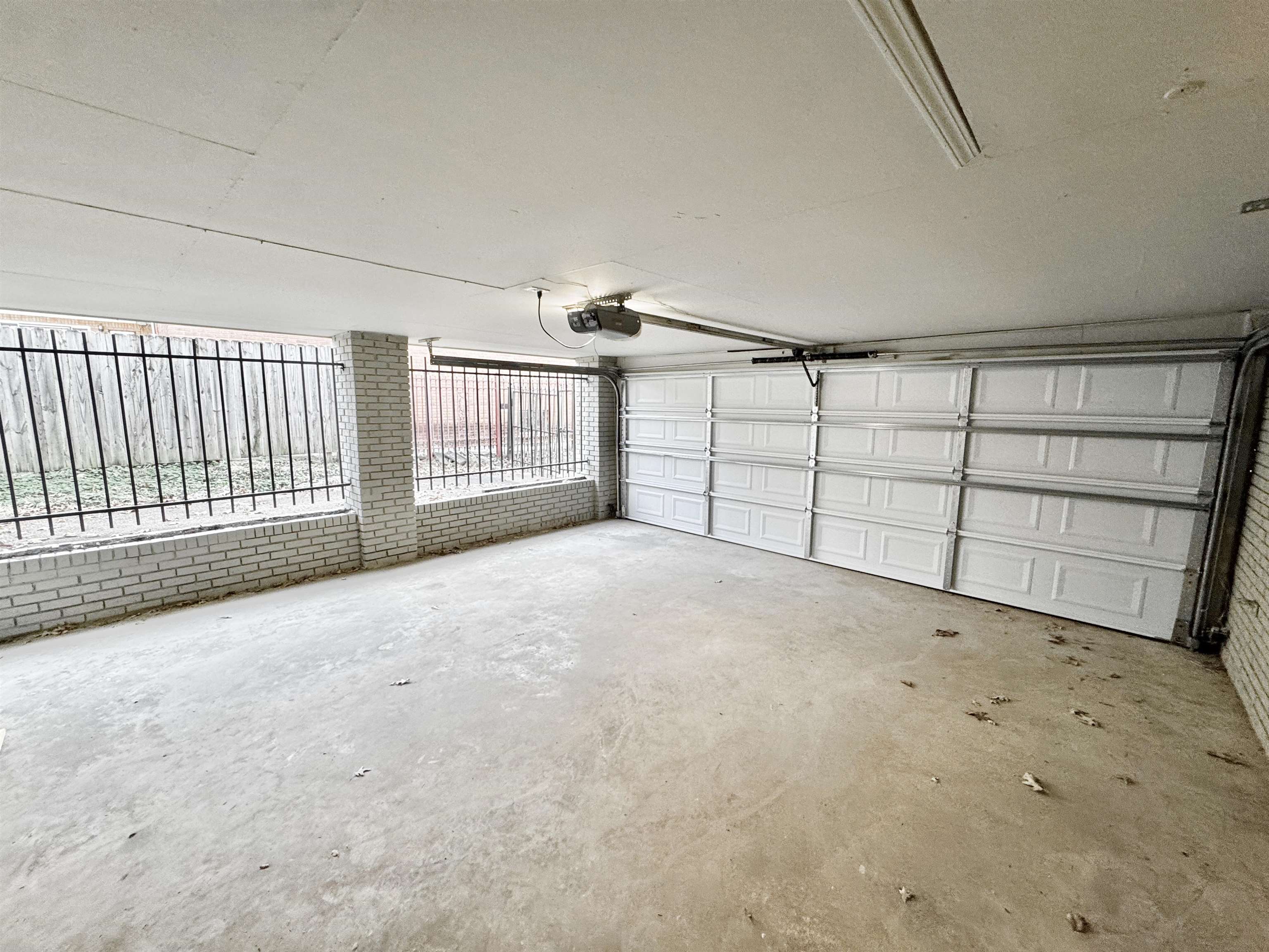 3836 Birchleaf Road Memphis, TN 38116 - Photo 35 of 40 Garage with a garage door opener
