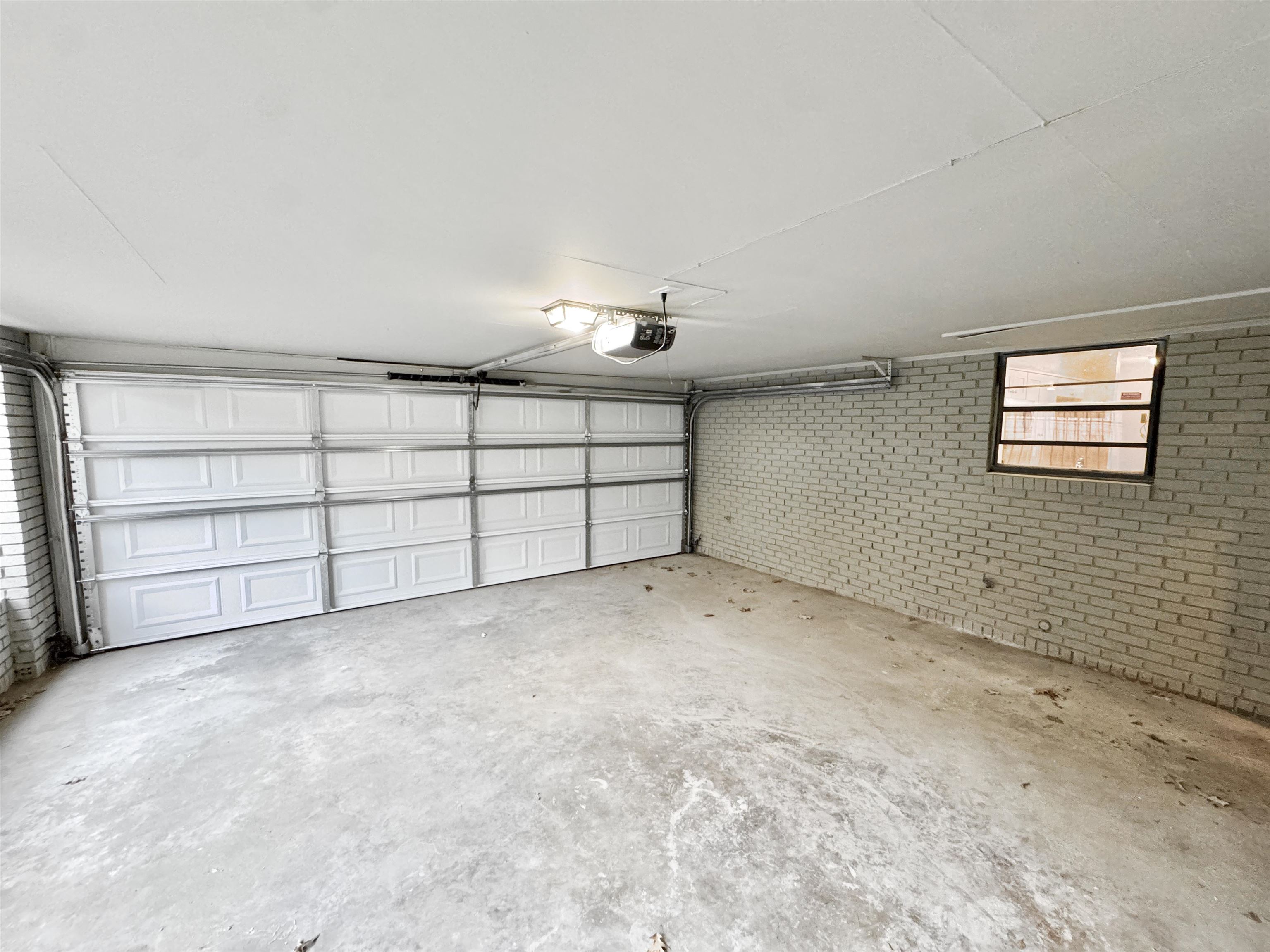 3836 Birchleaf Road Memphis, TN 38116 - Photo 36 of 40 Garage with a garage door opener