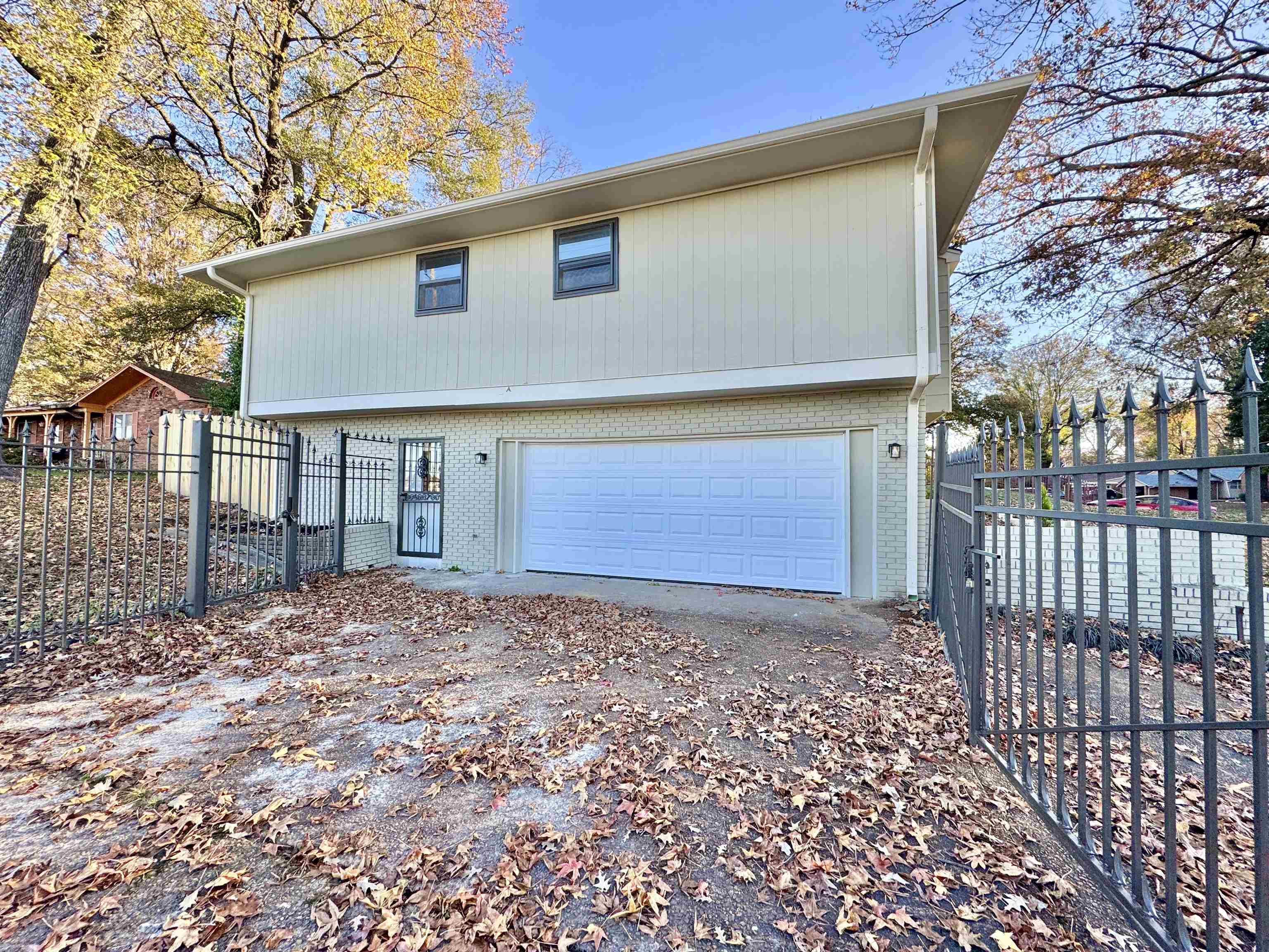 3836 Birchleaf Road Memphis, TN 38116 - Photo 38 of 40 View of front of home with brick siding, a garage, and driveway