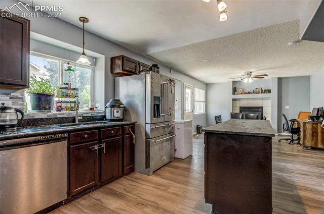 Kitchen has granite countertops and stainless appliances