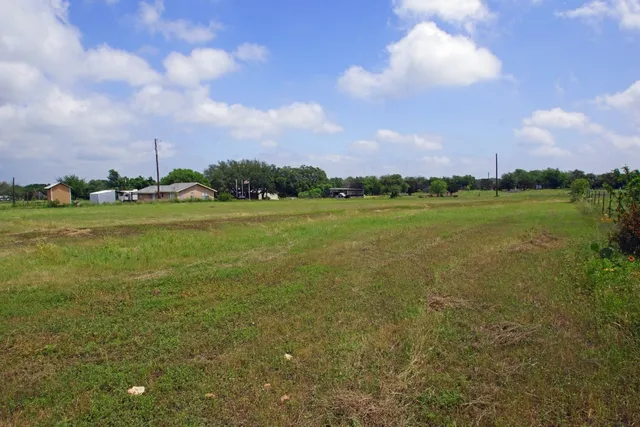 a view of a city with a building in the background