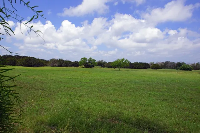 a view of a lake with a big yard