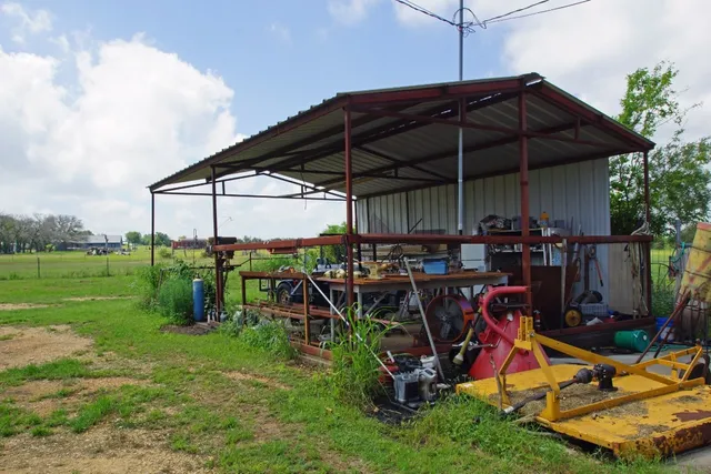a view of a chairs and table under an umbrella