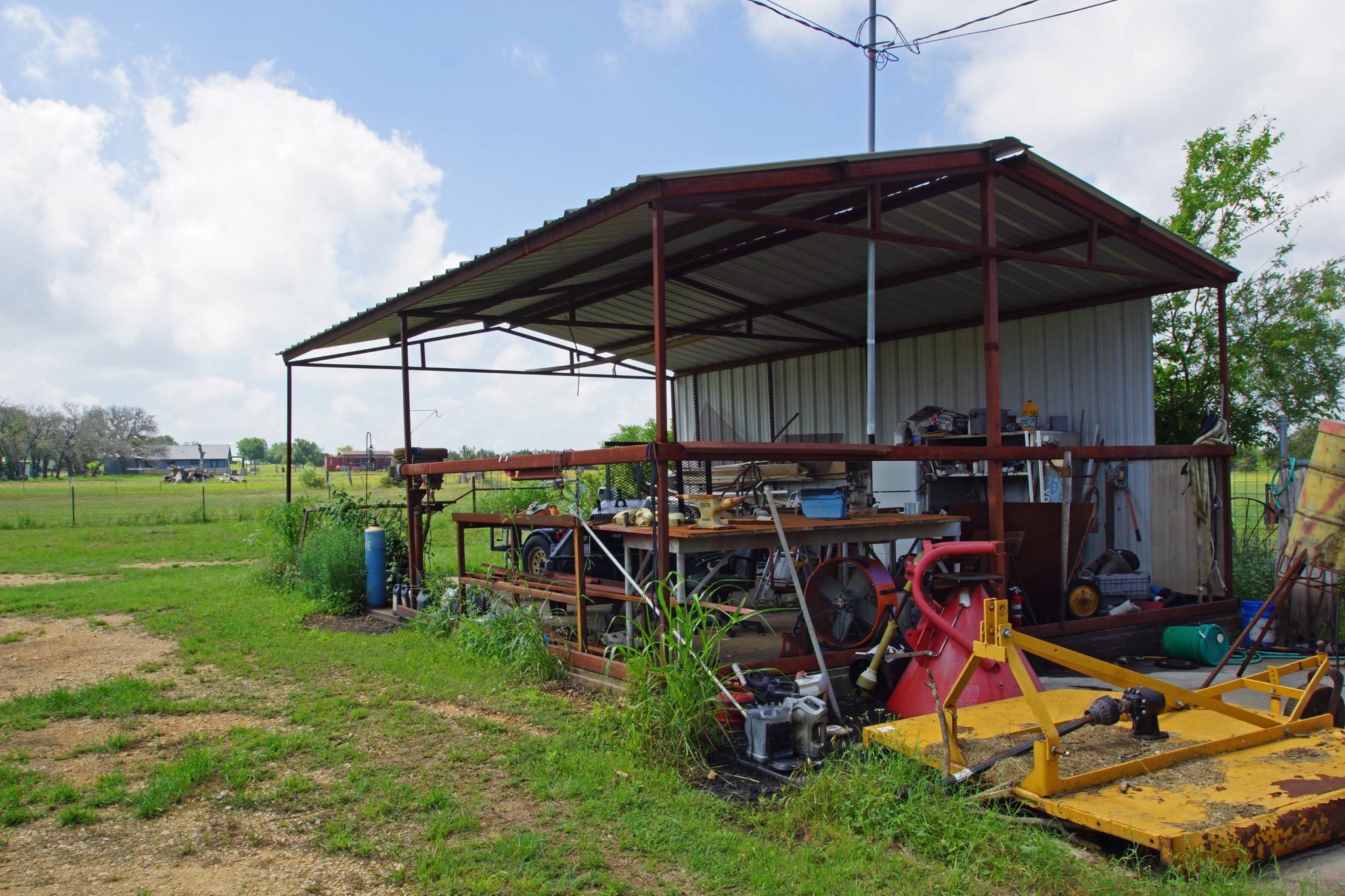 244 Apache Springs Road Briggs, TX 78608 - Photo 23 of 25 a view of a chairs and table under an umbrella