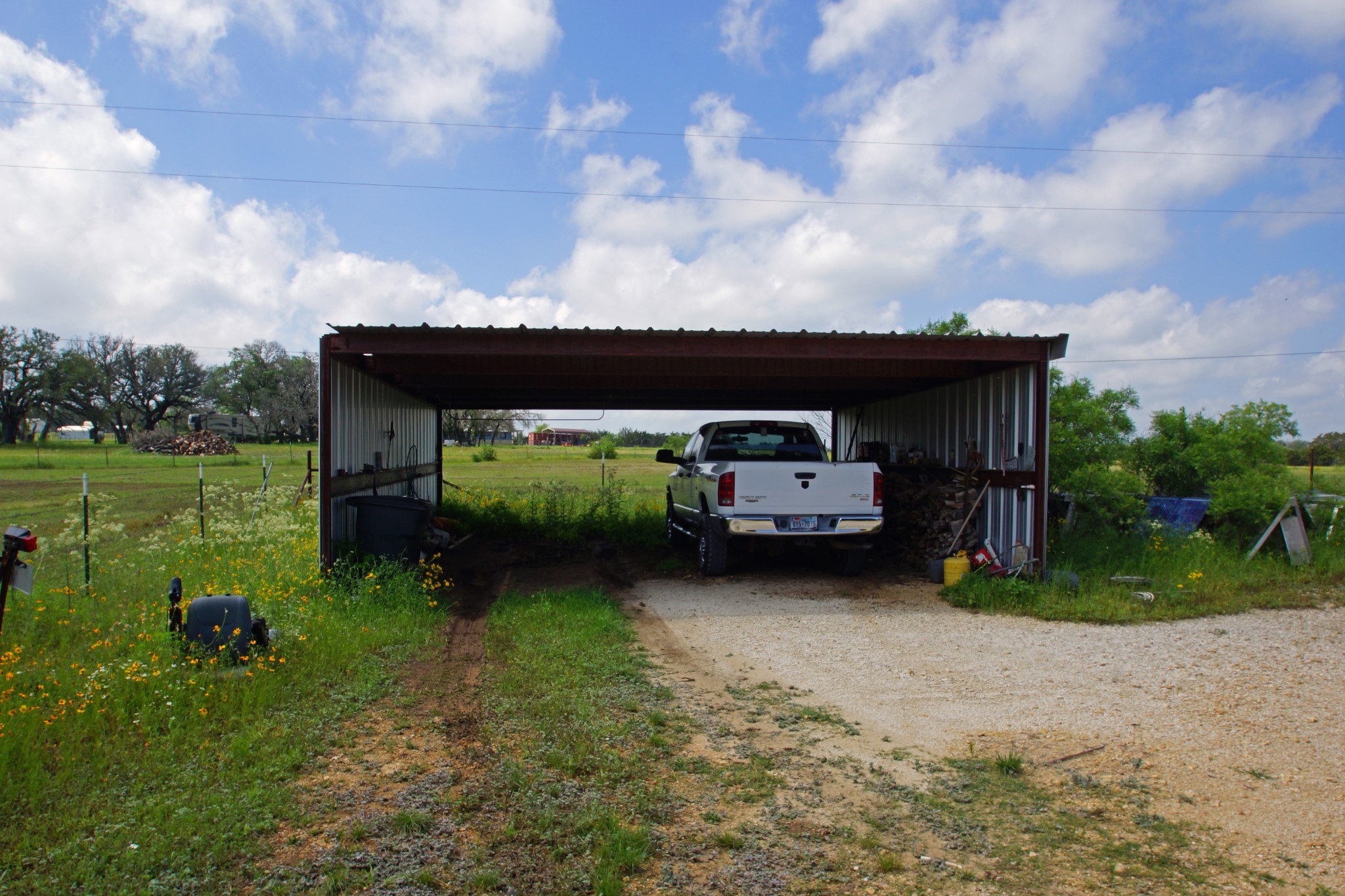 244 Apache Springs Road Briggs, TX 78608 - Photo 24 of 25 a view of a house with a back yard
