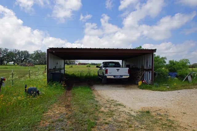 a view of a house with a back yard