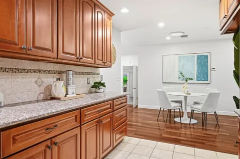 a kitchen with stainless steel appliances granite countertop a sink and cabinets