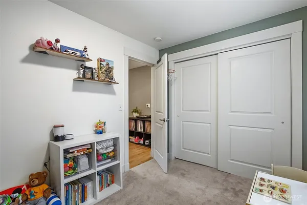 a room with toys and dresser