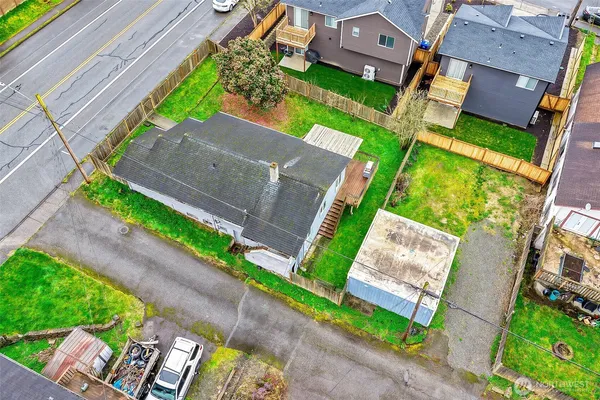 an aerial view of a house with a garden and plants
