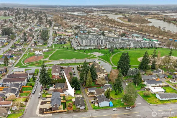 an aerial view of residential houses with outdoor space