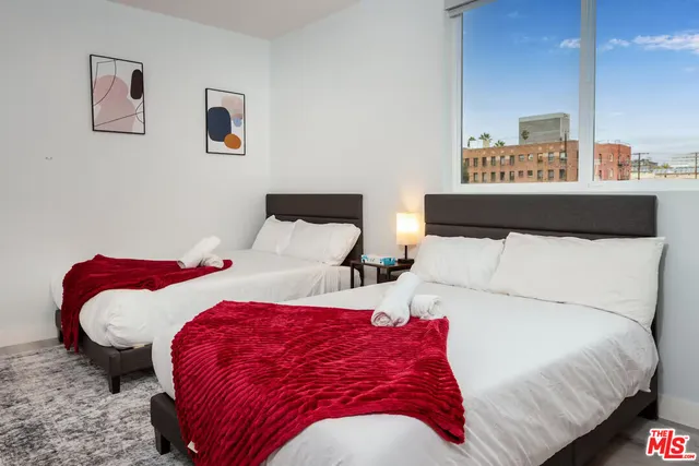 a bedroom with double bed and a lamp