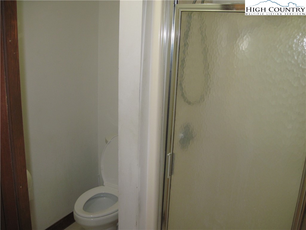 281 Old Turnpike Road Banner Elk, NC 28604 - Photo 17 of 22 a bathroom with a white toilet and sink