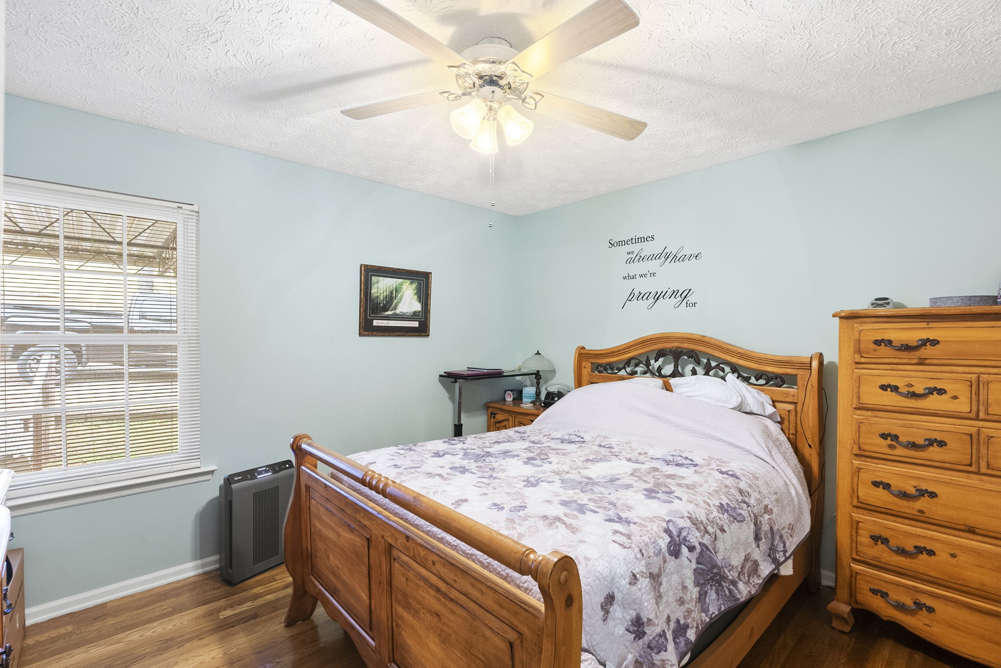 8320 Cedar Grove Road Cross Plains, TN 37049 - Photo 9 of 15 a bedroom with a bed and a chandelier