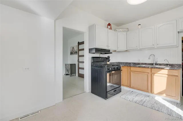 a view of a livingroom with furniture and a window
