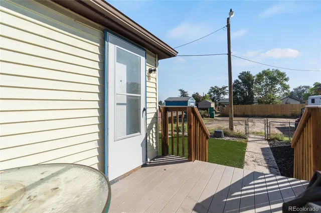 a view of a garden with a bench in the patio