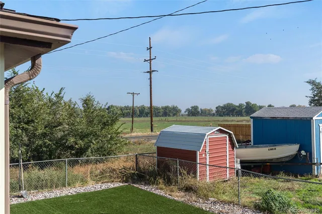 a view of a backyard with sitting area