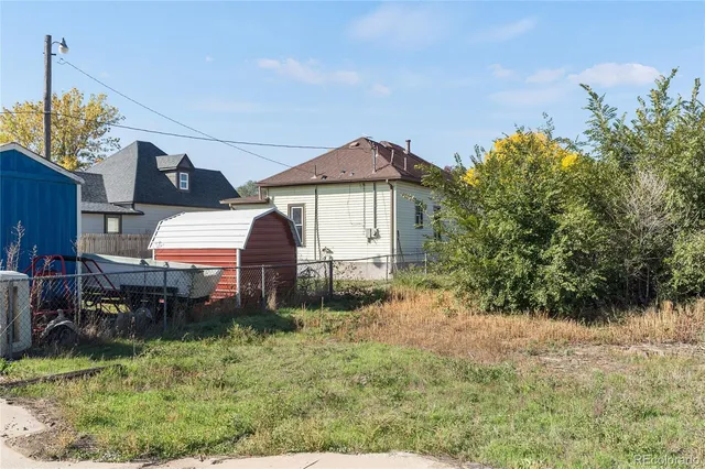 a view of a house next to a yard
