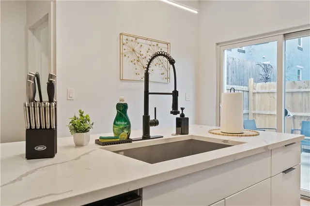 a kitchen with a stove and a refrigerator