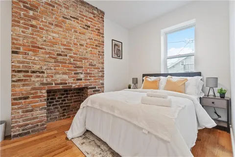a table with potted plant and a dresser