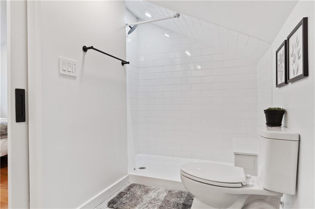 1238 Butterfield Way Pittsburgh, PA 15212 - Photo 24 of 25 a white toilet sitting next to a bathroom sink