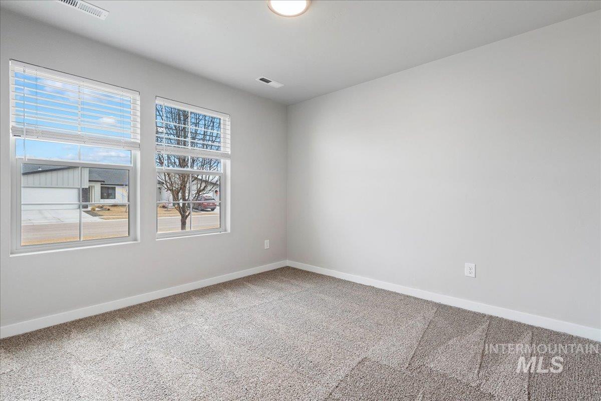 3079 S Green Boise, ID 83709 - Photo 18 of 35 Empty room with carpet flooring