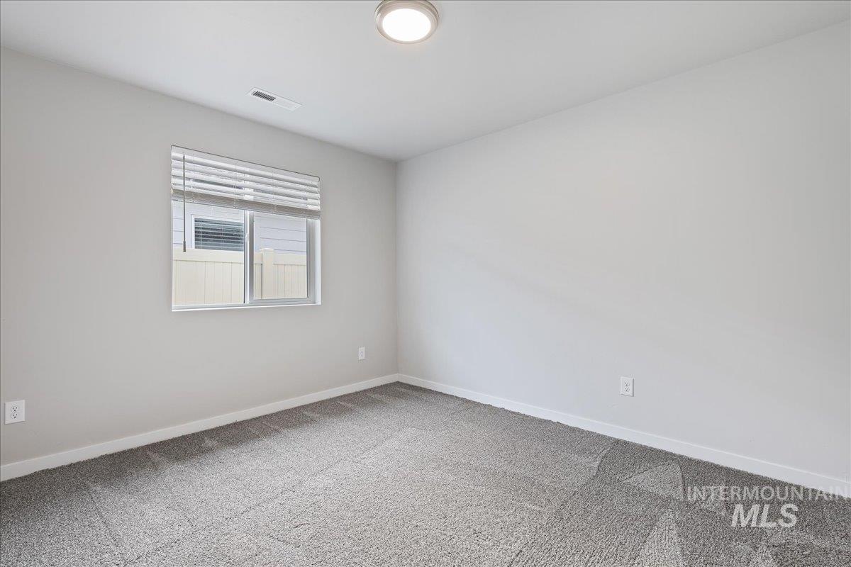 3079 S Green Boise, ID 83709 - Photo 20 of 35 Spare room with baseboards and carpet flooring