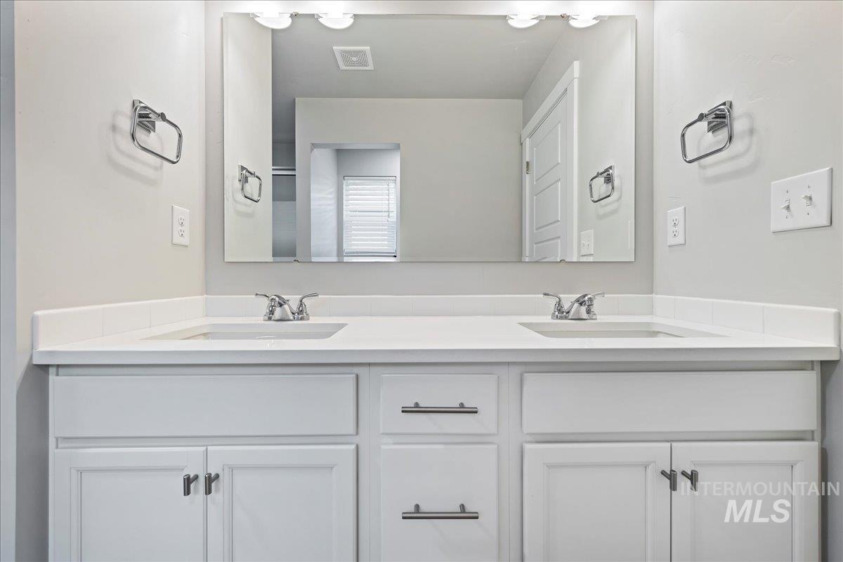 3079 S Green Boise, ID 83709 - Photo 26 of 35 Full bathroom featuring double vanity