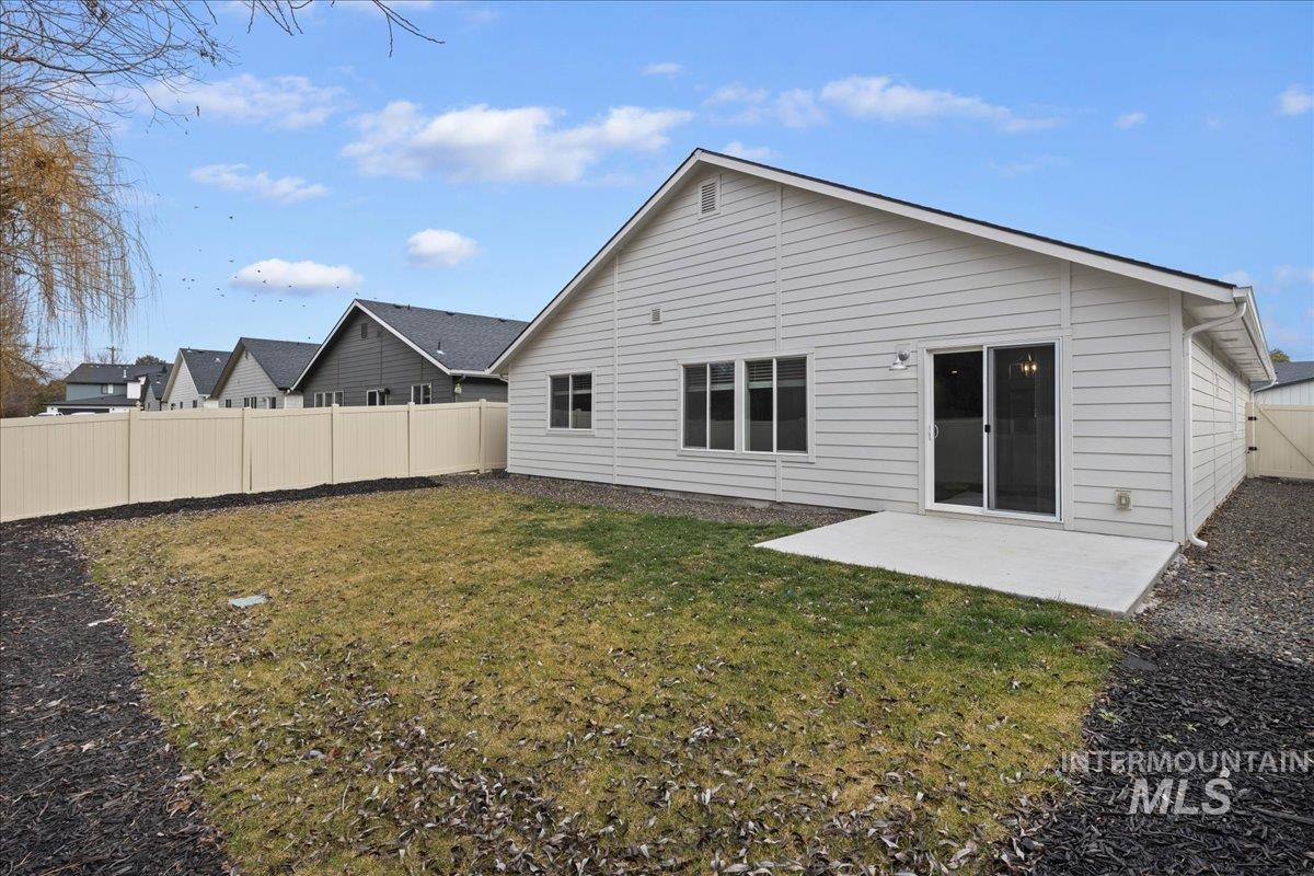 3079 S Green Boise, ID 83709 - Photo 31 of 35 Rear view of property with a patio and a fenced backyard