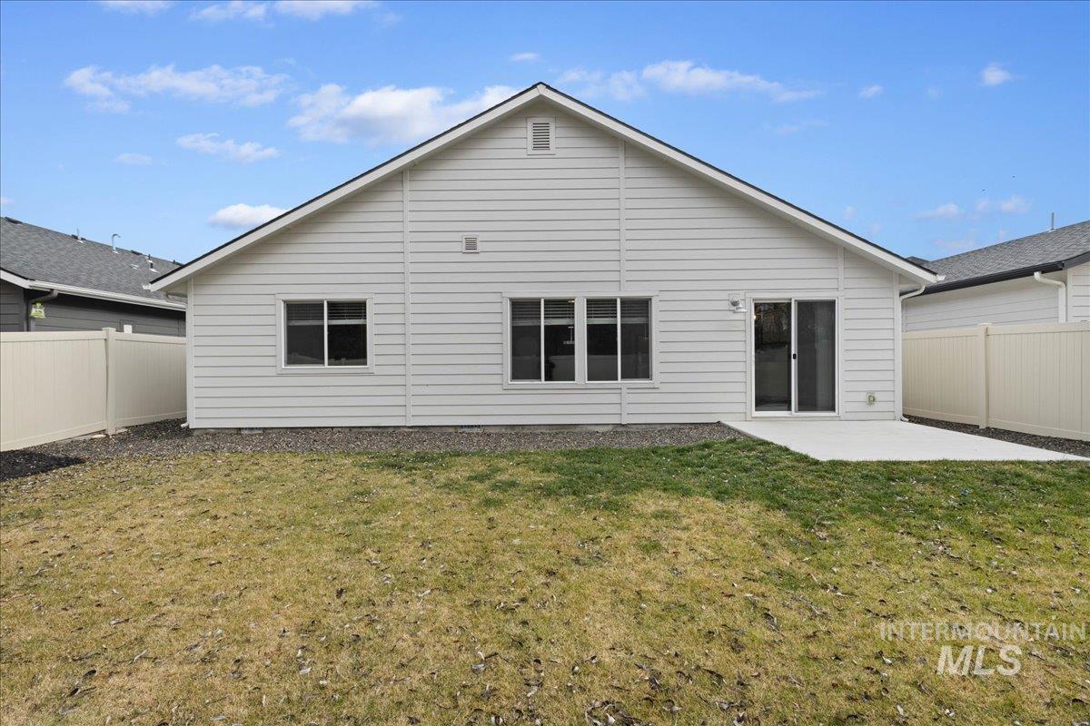 3079 S Green Boise, ID 83709 - Photo 32 of 35 Back of house featuring a fenced backyard and a patio