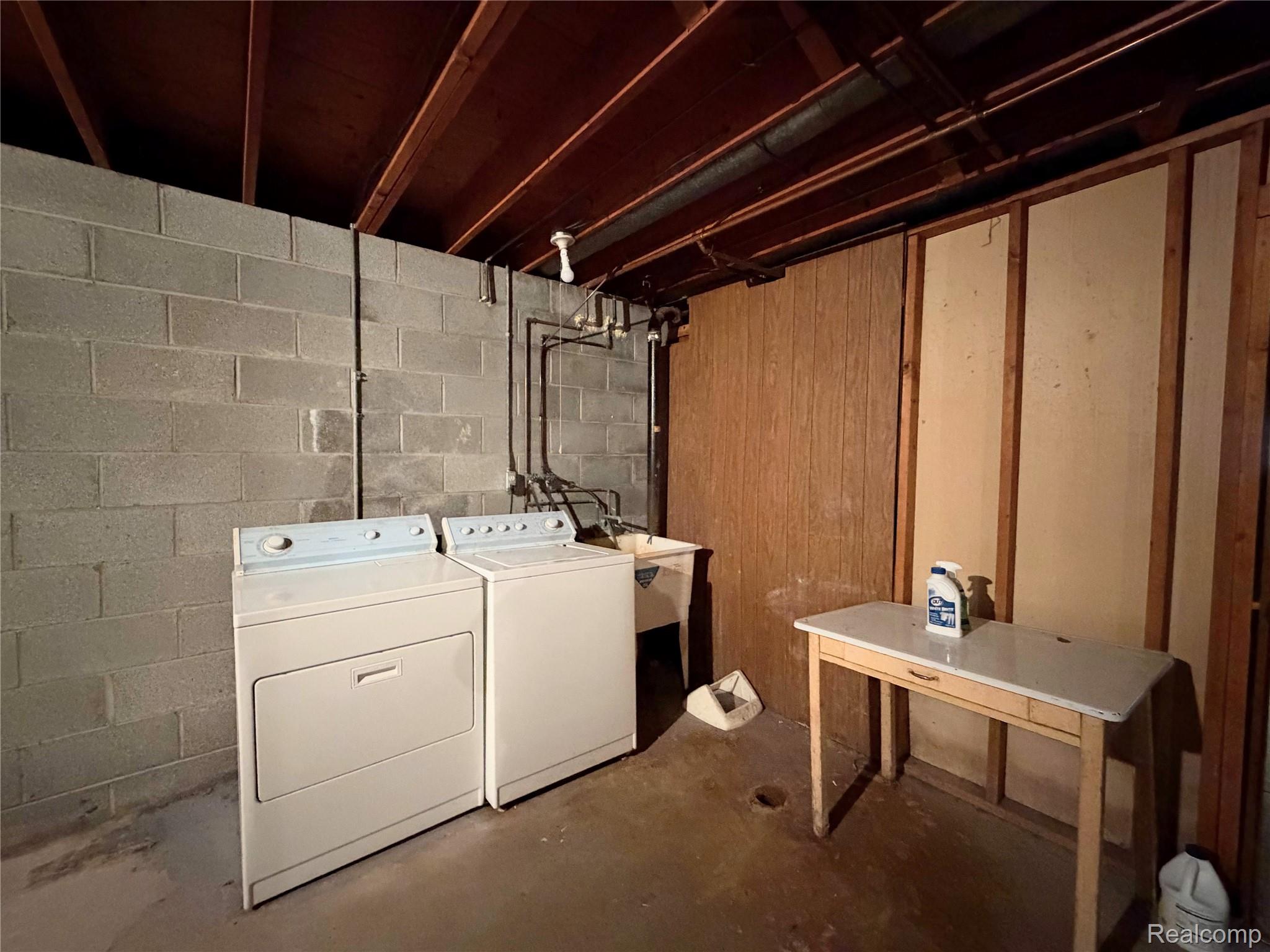 8079 Farley Road Pinckney, MI 48169 - Photo 26 of 43 Laundry area with unfinished concrete flooring and independent washer and dryer
