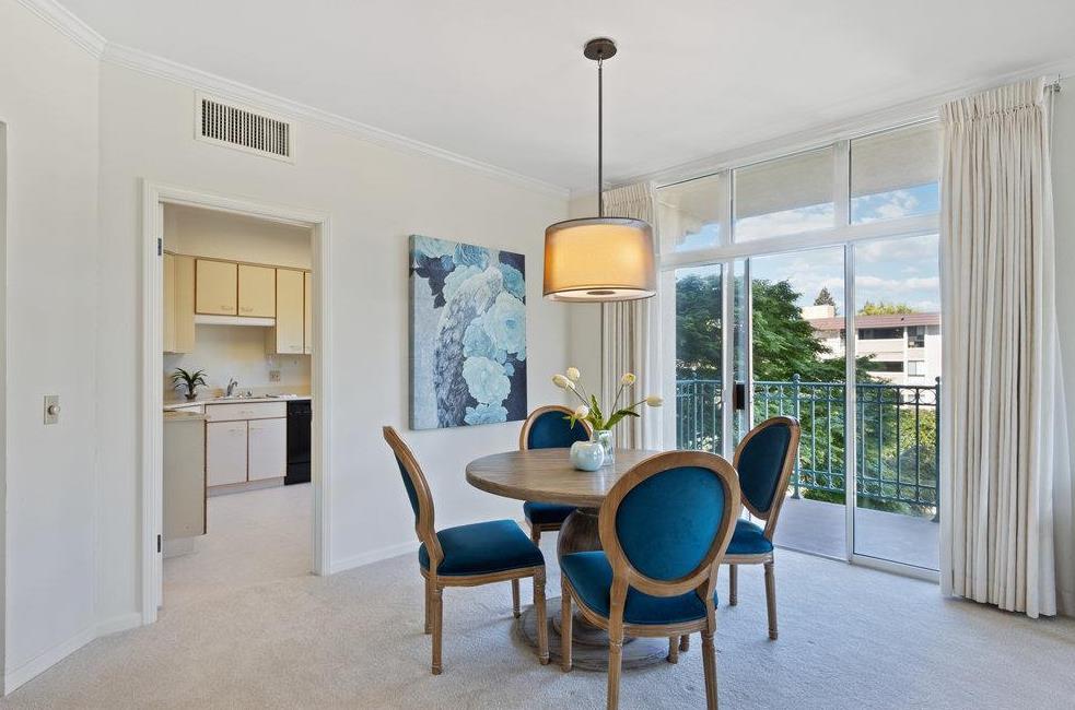 1 Baldwin Avenue, Unit 203 San Mateo, CA 94401 - Photo 2 of 13 a dining room with furniture a chandelier and window