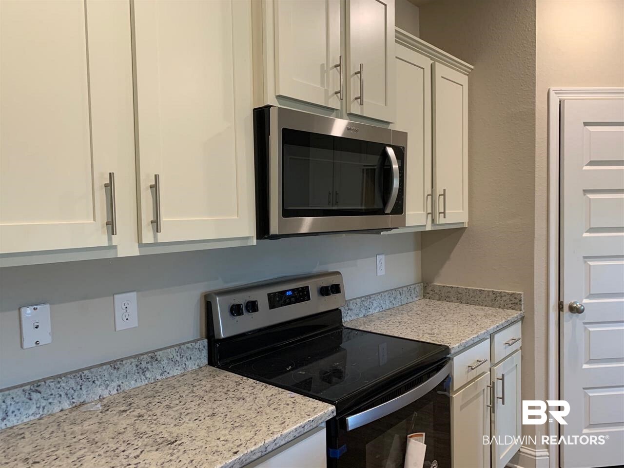 1332 Kairos Loop Foley, AL 36535 - Photo 7 of 17 Bistro white cabinets with Creme Pearl granite.