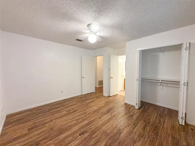 a backyard of a house with plants and outdoor seating