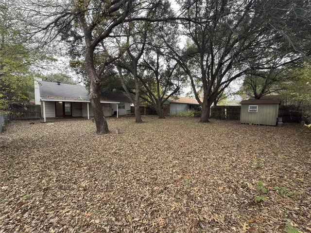a backyard of a house with lots of green space
