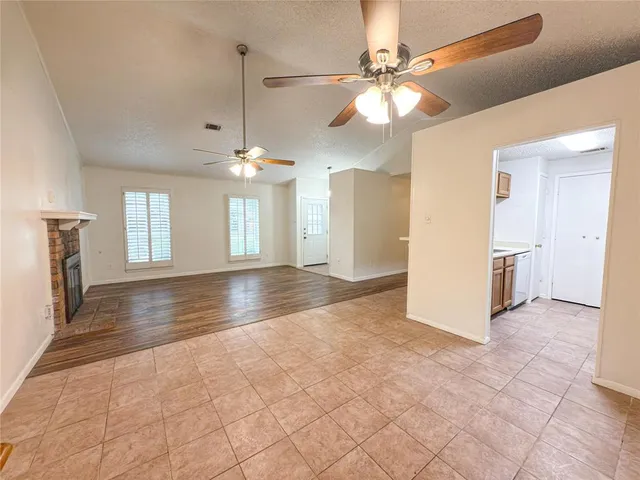 a view interior of a house with an entryway and chandelier fan