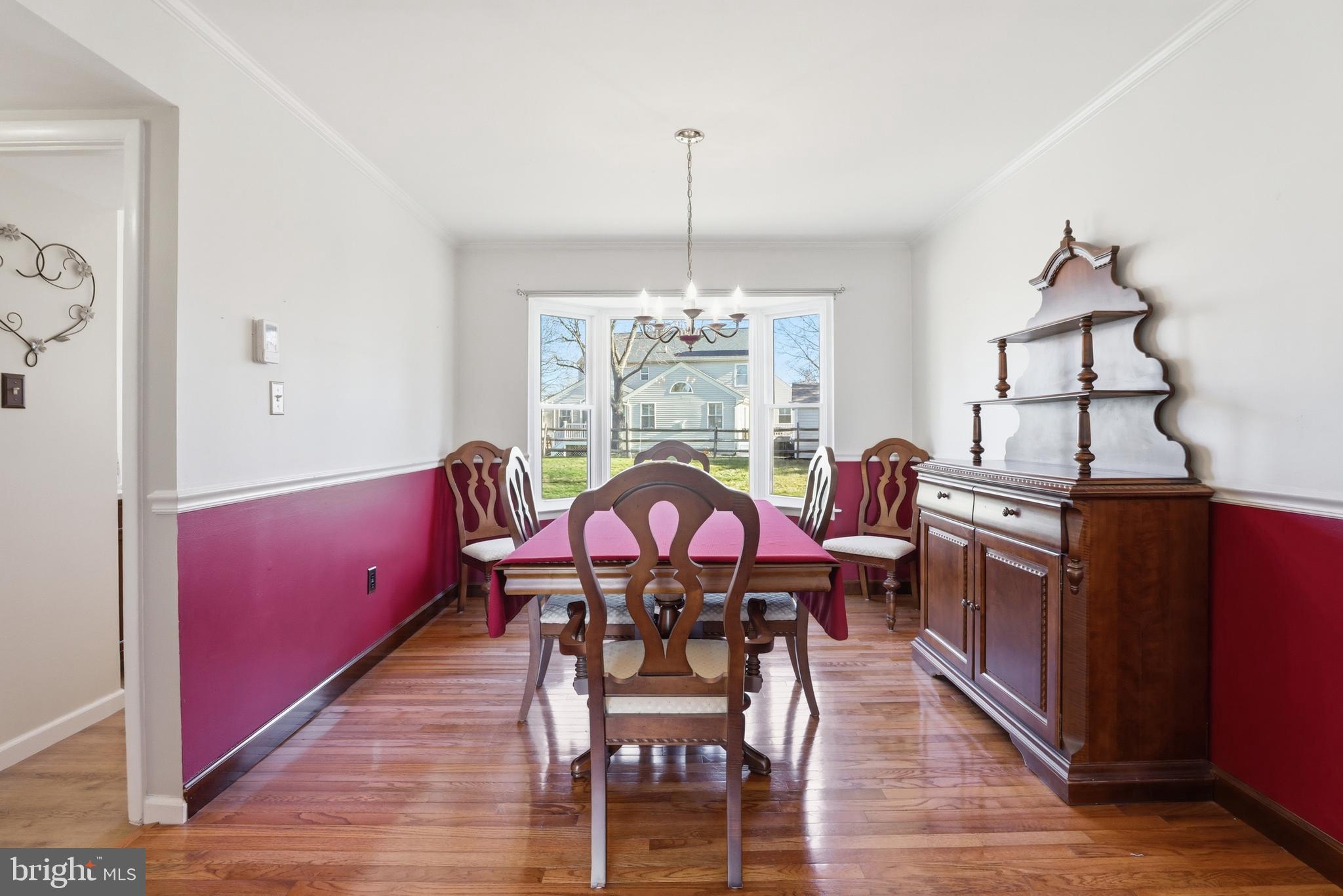 9709 Noble Ridge Terrace Gaithersburg, MD 20882 - Photo 12 of 64 a view of a dining room with furniture window and wooden floor