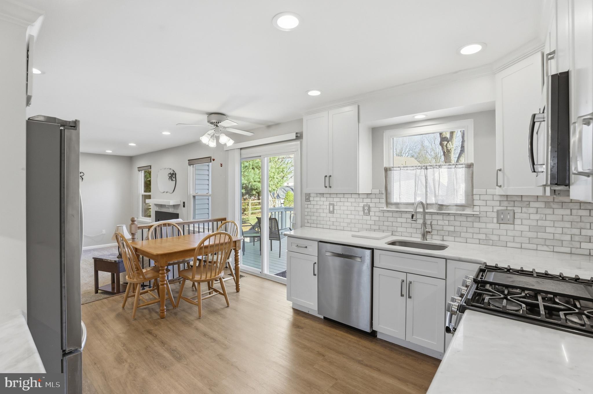 9709 Noble Ridge Terrace Gaithersburg, MD 20882 - Photo 15 of 64 a kitchen with stainless steel appliances kitchen island granite countertop a sink and cabinets