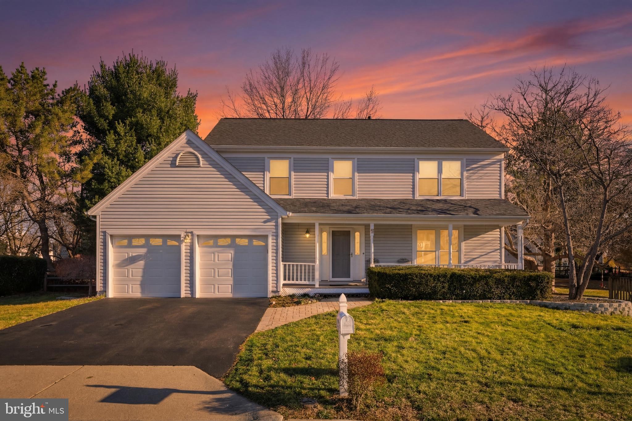 9709 Noble Ridge Terrace Gaithersburg, MD 20882 - Photo 2 of 64 a front view of a house with a yard