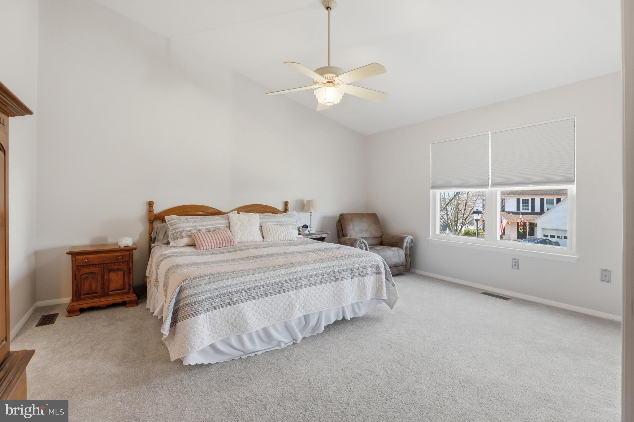 9709 Noble Ridge Terrace Gaithersburg, MD 20882 - Photo 22 of 64 a bedroom with a bed and a chandelier