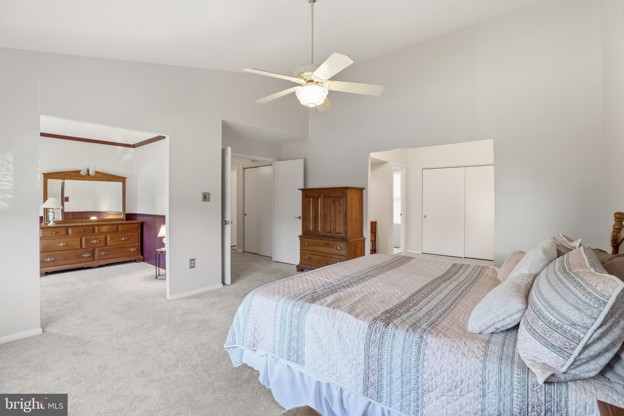 9709 Noble Ridge Terrace Gaithersburg, MD 20882 - Photo 24 of 64 a spacious bedroom with a bed and cabinets