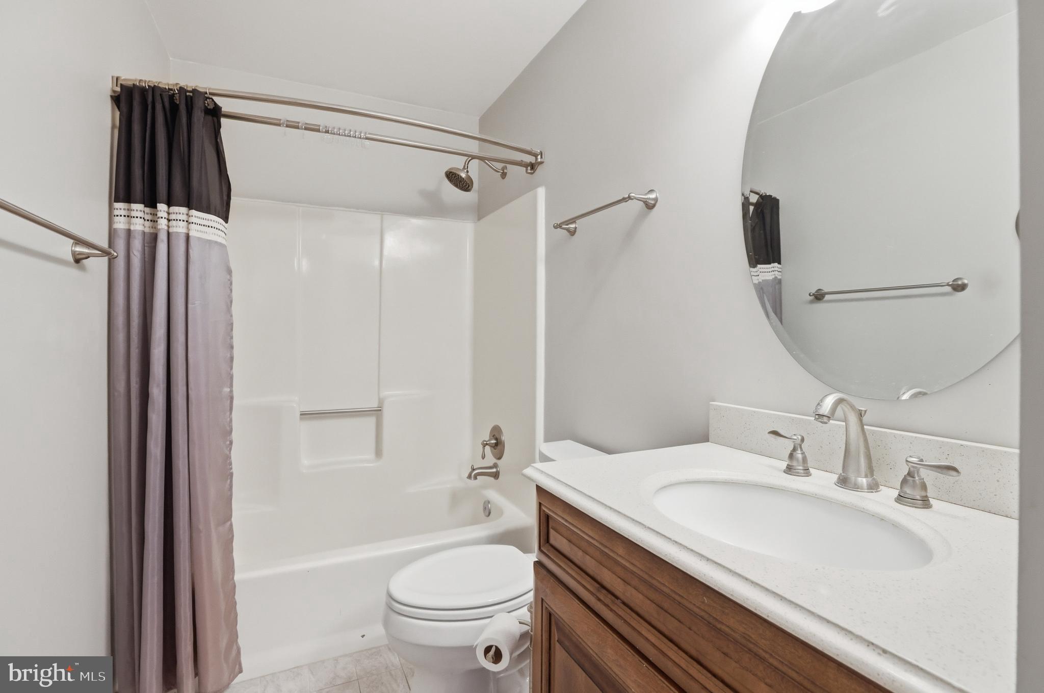 9709 Noble Ridge Terrace Gaithersburg, MD 20882 - Photo 30 of 64 a bathroom with a granite countertop sink toilet and shower