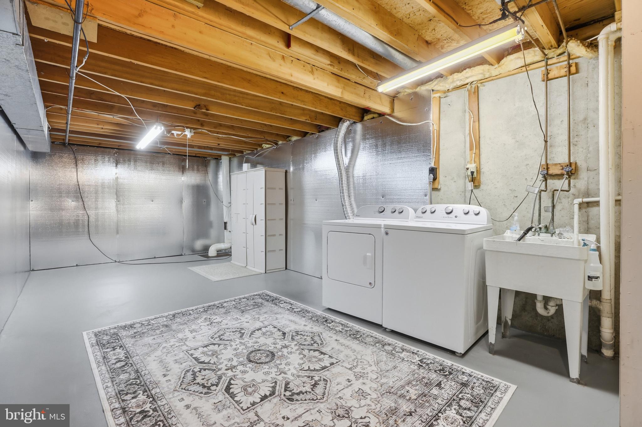 9709 Noble Ridge Terrace Gaithersburg, MD 20882 - Photo 40 of 64 a view of a hallway with entryway and chandelier
