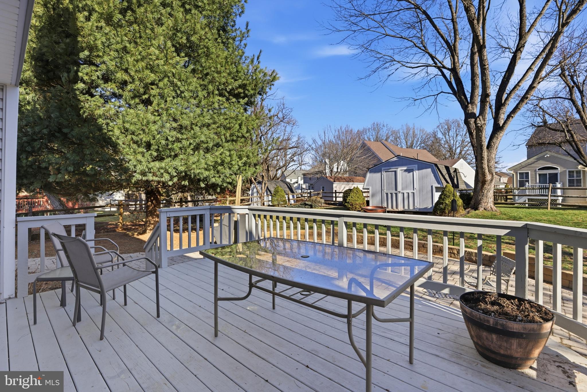 9709 Noble Ridge Terrace Gaithersburg, MD 20882 - Photo 42 of 64 a view of a chairs on deck and a patio