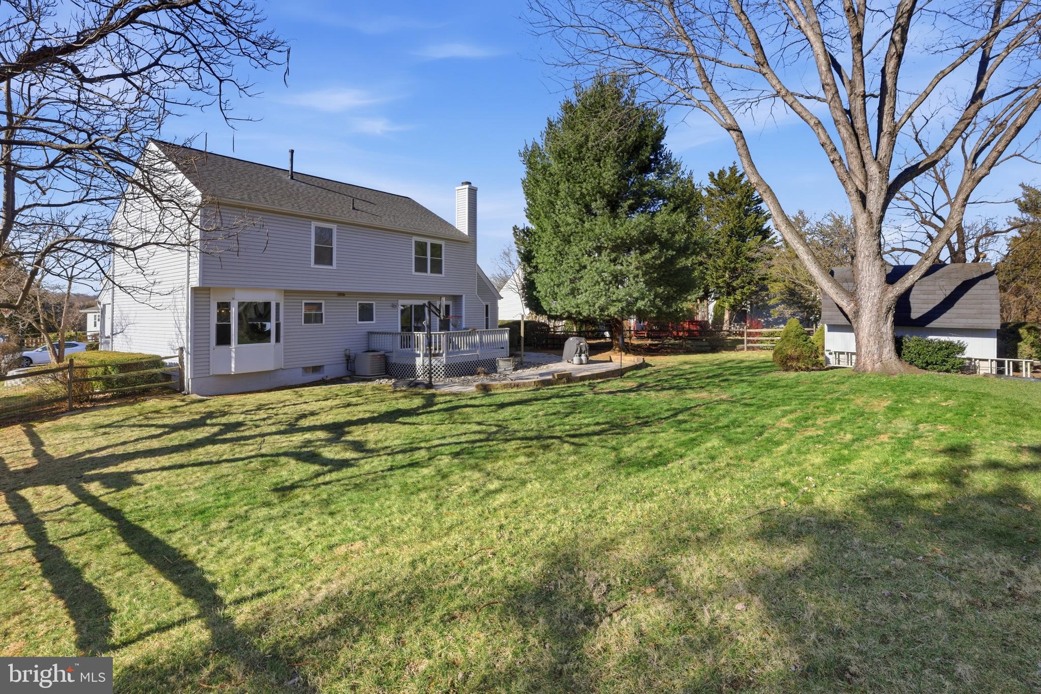 9709 Noble Ridge Terrace Gaithersburg, MD 20882 - Photo 44 of 64 a view of a house with a yard patio and tree